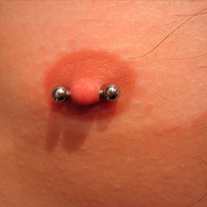 Male nipple piercing
