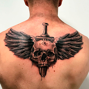 Winged and impaled skull